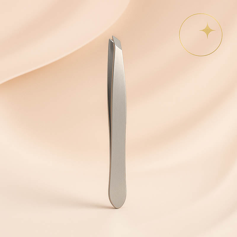 Luxury stainless steel slanted tweezers displayed on a soft blush background — precision tip design for estheticians and skincare professionals, elegant and high-end spa aesthetic optimized for Shopify beauty product listings.