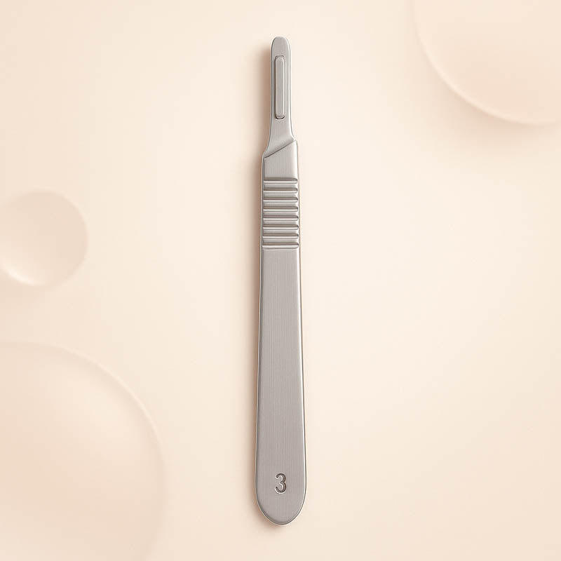 Luxury #3 stainless steel dermaplaning handle displayed on a soft blush background — engraved with “3” near the base, featuring a polished, ergonomic design ideal for estheticians and professional skincare treatments, styled for high-end Shopify product listings.