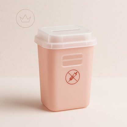 Elegant sharps container for estheticians displayed with soft gold lighting and spa-inspired luxury aesthetic