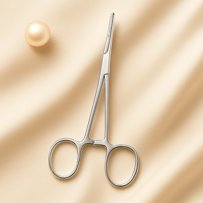 Close-up of stainless steel hemostatic forceps used by estheticians for precision dermaplaning and skincare treatments, displayed on a clean neutral background for a professional, medical-grade aesthetic