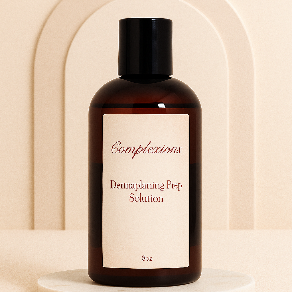 Luxury amber bottle of Complexions Dermaplaning Prep Solution displayed on a beige marble spa surface with soft lighting, professional skincare packaging for estheticians